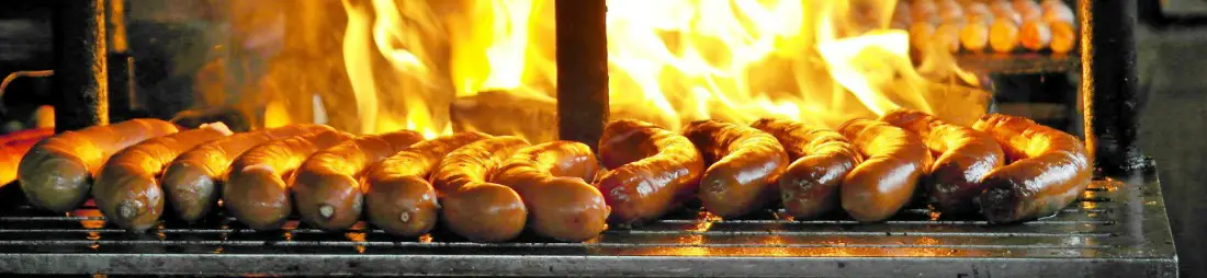 Bratwurst sausages on grill